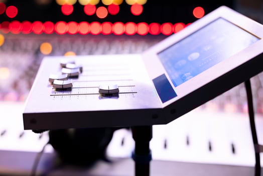 Professional recording music studio with motorized faders gear and other knobs used in post production, control room equipment. Stereo electronic tools used in editing new tracks. Close up. photo