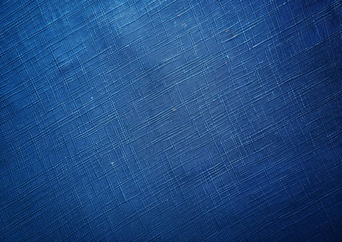 a solid blue background with a smooth fabric texture photo