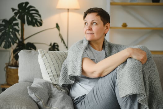 attractive middle aged woman relaxing at home. photo