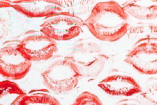Imprint of red lips on white paper, kiss background photo