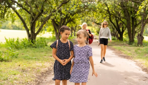 Two little kids going to school together photo