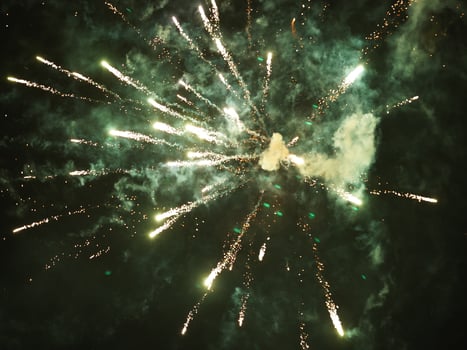 The colorful and beautiful fireworks show with the dark sky as background at night photo