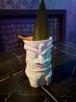 ceramic glass for cocktails in folk style with green leaf photo