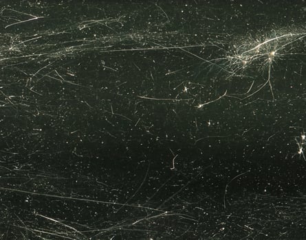 close up of black and white dust and scratches grunge overlay texture photo