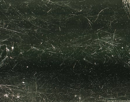 close up of black and white dust and scratches grunge overlay texture photo