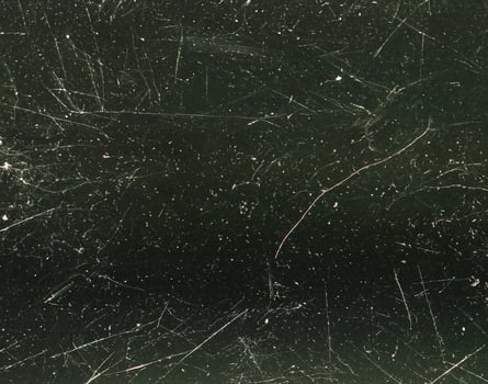 close up of black and white dust and scratches grunge overlay texture photo