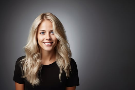 smiling young woman with blond hair and blue eyes photo