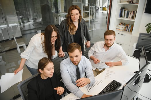 Group of businessmen and businesswomen stock brokers working at office. photo
