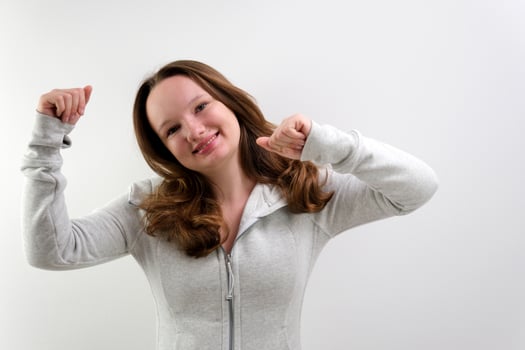 young woman performing funny dance photo