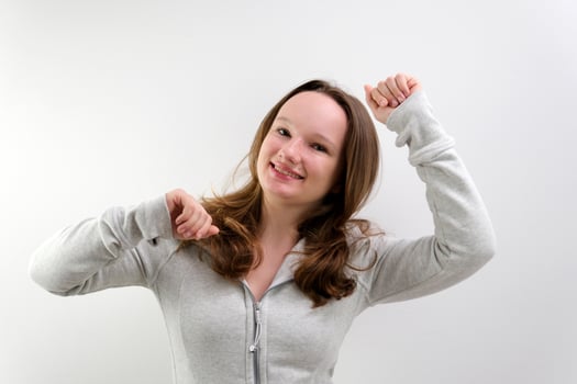 Lovely cheerful young woman greatly approves your suggestion, shaking head approvely, satisfied with good quality work, like proposal, Yes. Pretty one pretty girl isolated on gray studio background photo