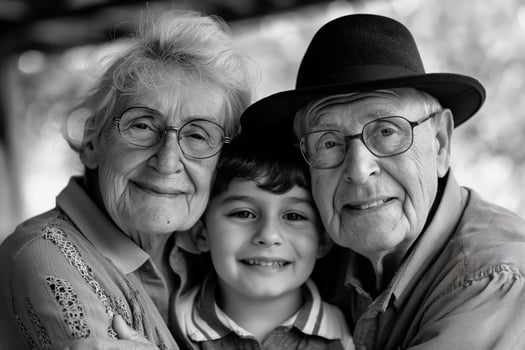 Portrait of happy grandparents with their grandson. photo
