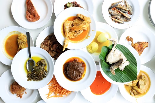 Nasi Padang, various Minang Side Dish on the Table photo
