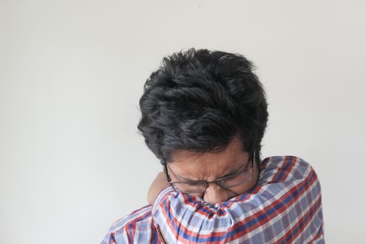 sick man covering mouth and nose with arm, Concept of stop spread of the virus photo