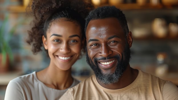 Portrait of an elderly African American couple smiling warmly in their kitchen surrounded by fresh vegetables. photo