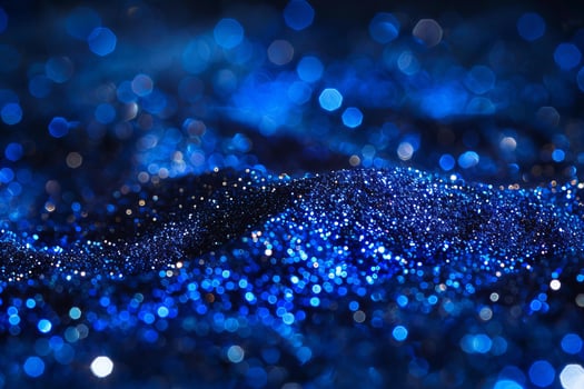 Spectacular Blue Bokeh Lights on Dark Glittering Surface photo