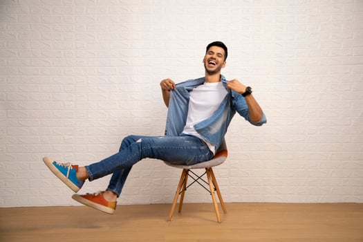Modern Cute Man Is Posing Over White Background photo