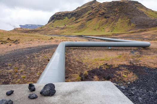 geothermal energy pipelines running along the desert hills of iceland photo