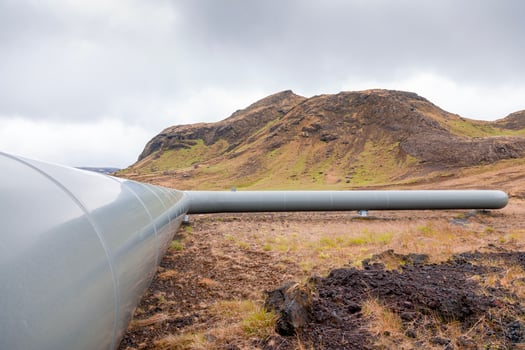 geothermal energy pipelines running along the desert hills of iceland photo