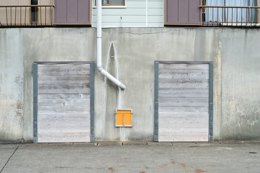 Textured ship warehouse with yellow box in the harbor photo