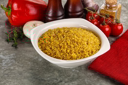 Dry wheat bulgur cereal heap photo