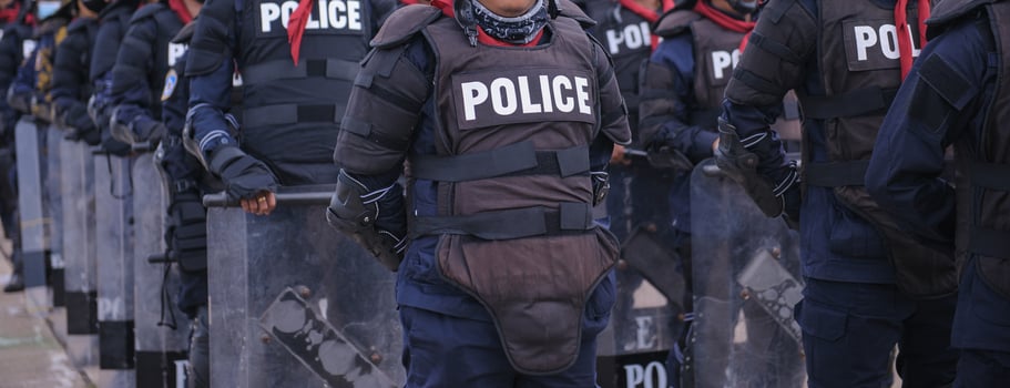 Riot police control the crowd.. photo