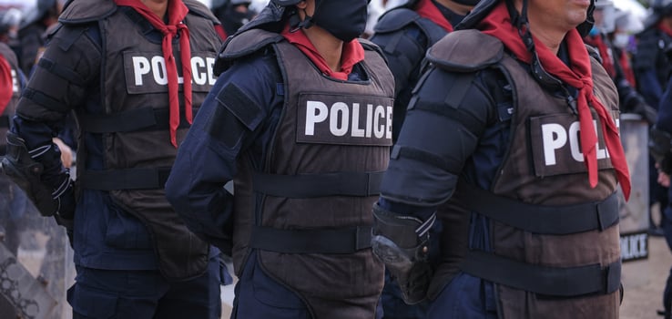 Riot police control the crowd.. photo