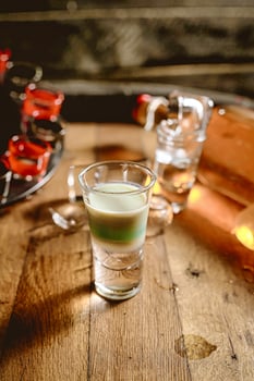 Wooden Table With Two Glasses of Liquid photo