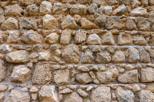 Texture of an ancient brick wall made of sandstone. Archaeological excavations photo