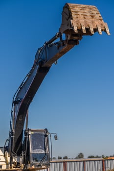Close up details of industrial excavator working on construction site 6 photo