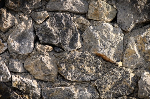 Wall of stones as a texture for background photo