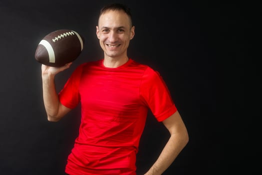 A rugby player, isolated on black photo