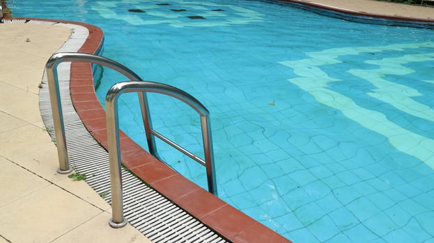 Swimming pool with stairs, swimming pool handrails photo