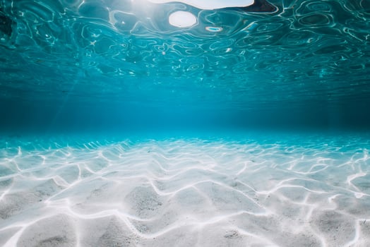 Turquoise ocean with sand underwater in Florida. Ocean background photo