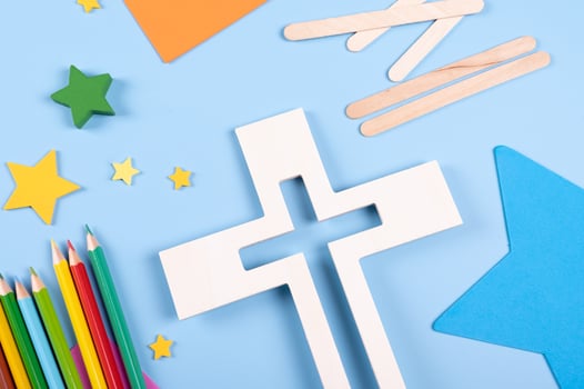 Vacation Bible School craft supply with wooden cross. Christian concept. photo