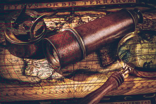 Old vintage compass on ancient map photo