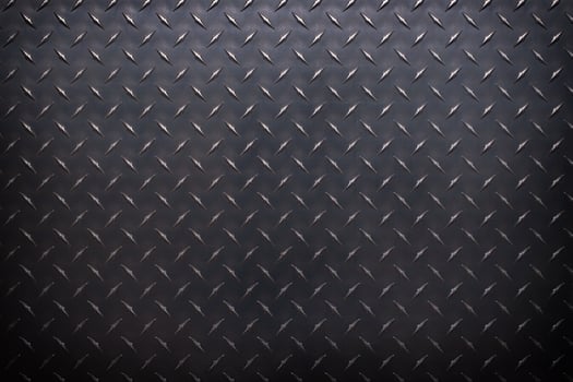black metal plate with corrugated texture. steel sheet as a background. photo