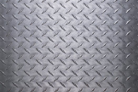 shiny metal texture with diamond pattern. stainless steel background photo