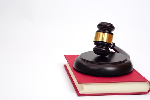 Selective focus, judge gavel or lawyer or law or justice placed on law book on white background. photo