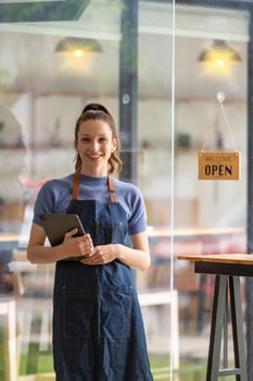 Portrait of Startup business owner. SME entrepreneurs are proud of their coffee shop business. photo