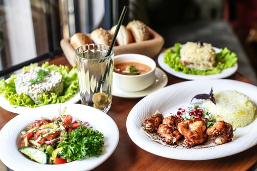 Wooden Table Set With Platters of Food photo
