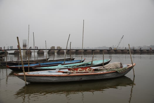 fishing boats on the ganga river, varanasi, india photo
