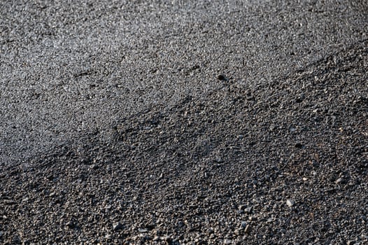 New asphalt tarmac texture road of repairing on the damaged highway photo