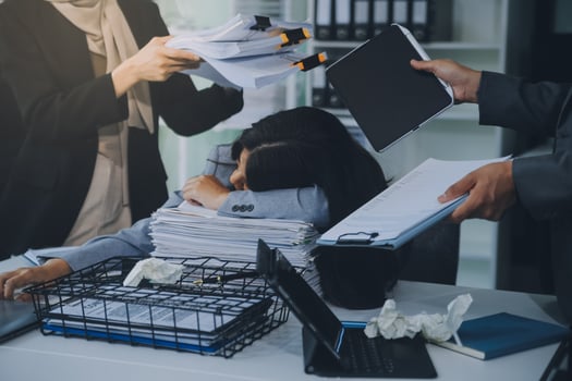 Stressful business man have so many paperwork in the office photo