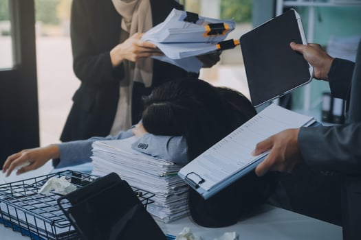 Stressful business man have so many paperwork in the office photo