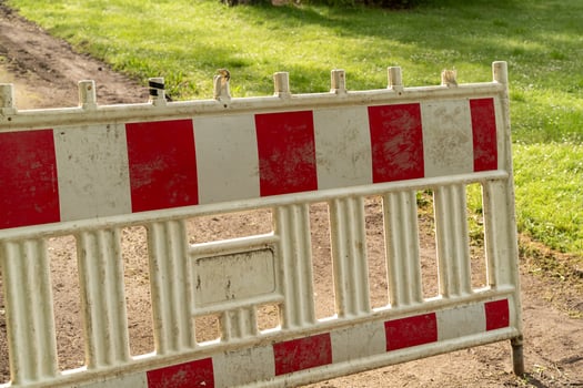 Construction site, white red barrier along the road photo