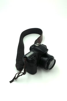 Black digital SLR camera in a white background photo