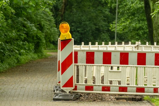 Construction site, white red barrier along the road photo
