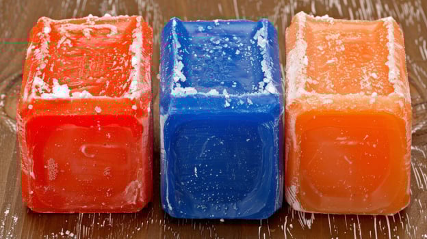 Colorful Homemade Soap Bars on Wooden Surface photo
