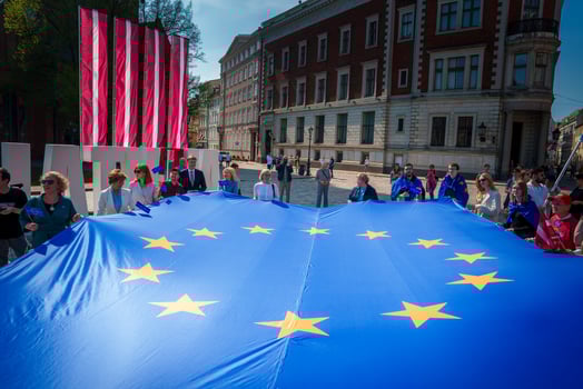 Vibrant Celebration in Old Town Riga, Latvia EU Flag Display photo