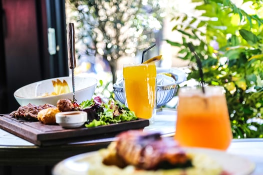 Delicious Plate of Food With Refreshing Glass of Orange Juice photo